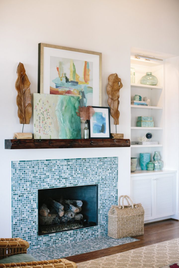 Living room with blue decor and blue tile fireplace surround