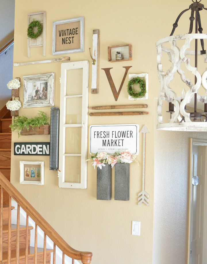 Farmhouse style decor gathered together to create a gallery wall.