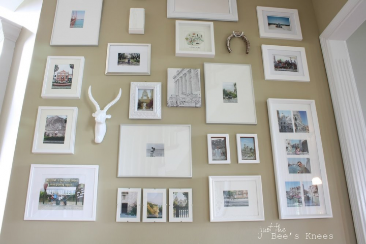 White framed photographs in a gallery style setup. 