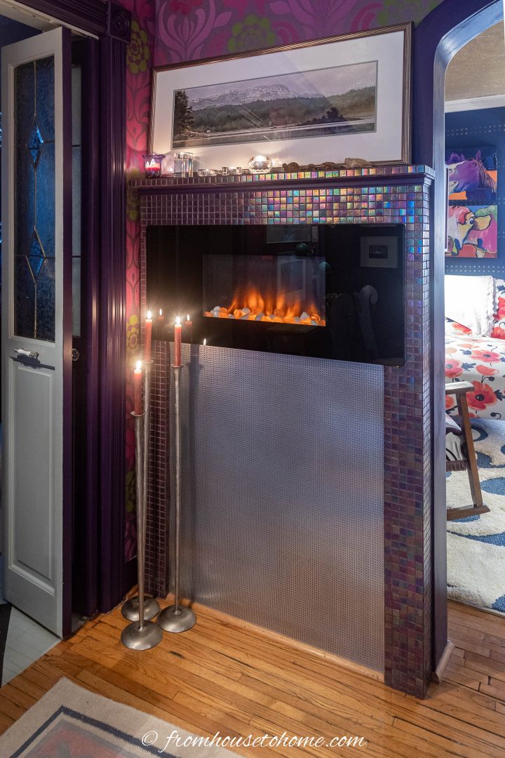 Electric fireplace on the wall in a small living room