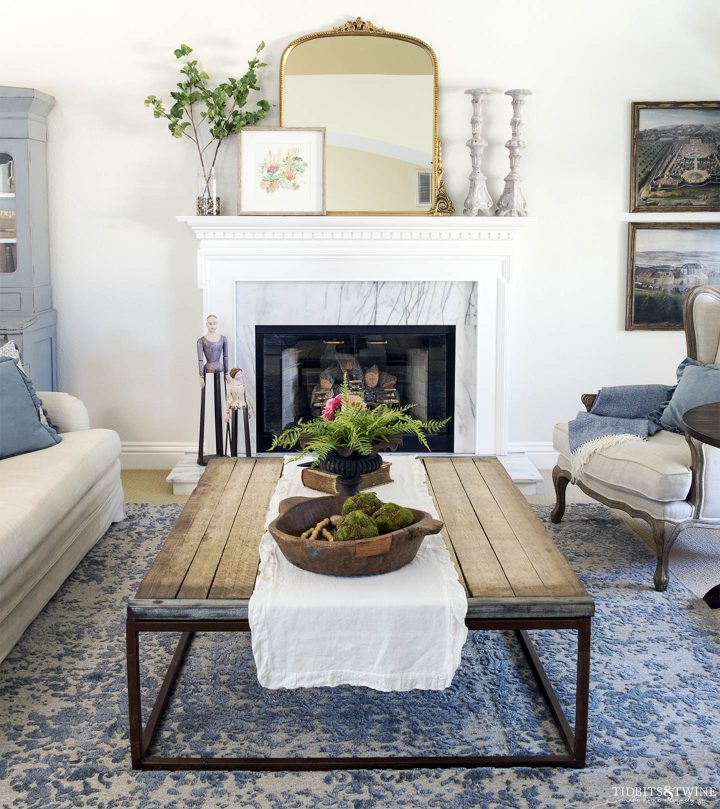 Living room wall with fireplace painted in Benjamin Moore Classic Gray (©tidbitsandtwine.com)