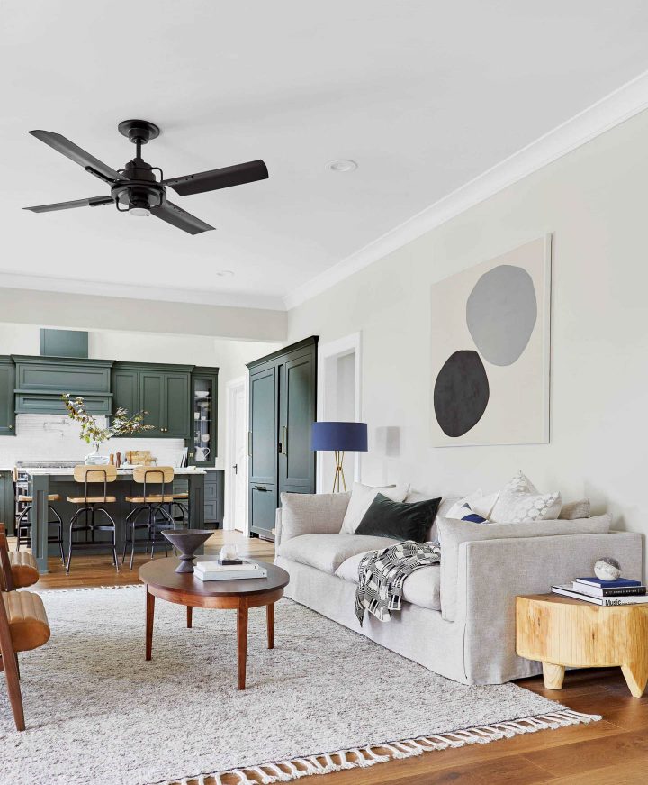 Mid-century modern living room painted in a neutral paint color - Sherwin Williams Oyster White  (©stylebyemilyhenderson.com)
