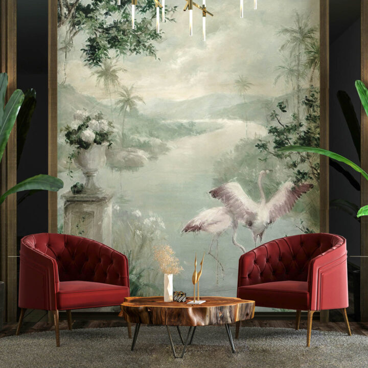 small living room with two club chairs, a wood coffee table and a large mural on the wall