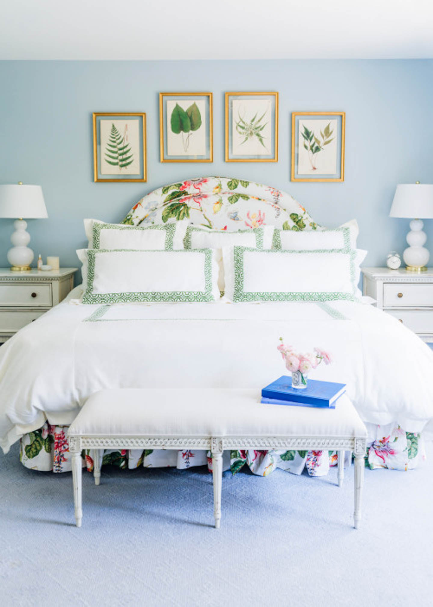 Bedroom painted with light blue walls and decorated with nature-inspired accessories