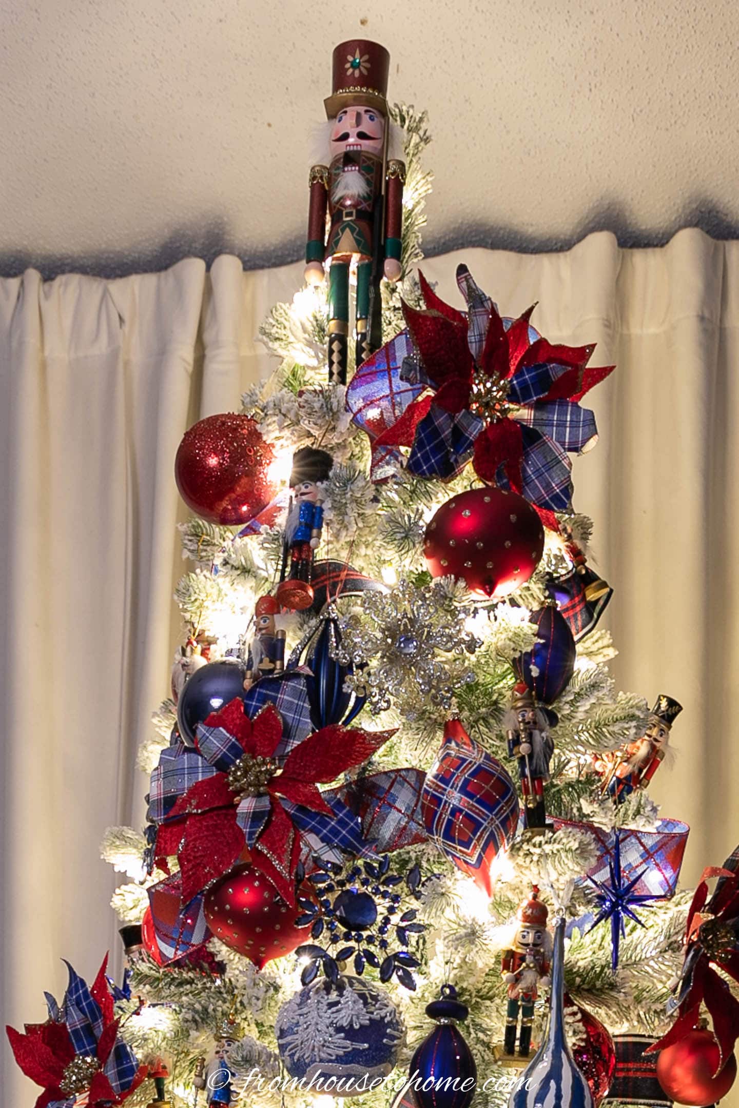 Nutcracker tree topper on a Christmas tree