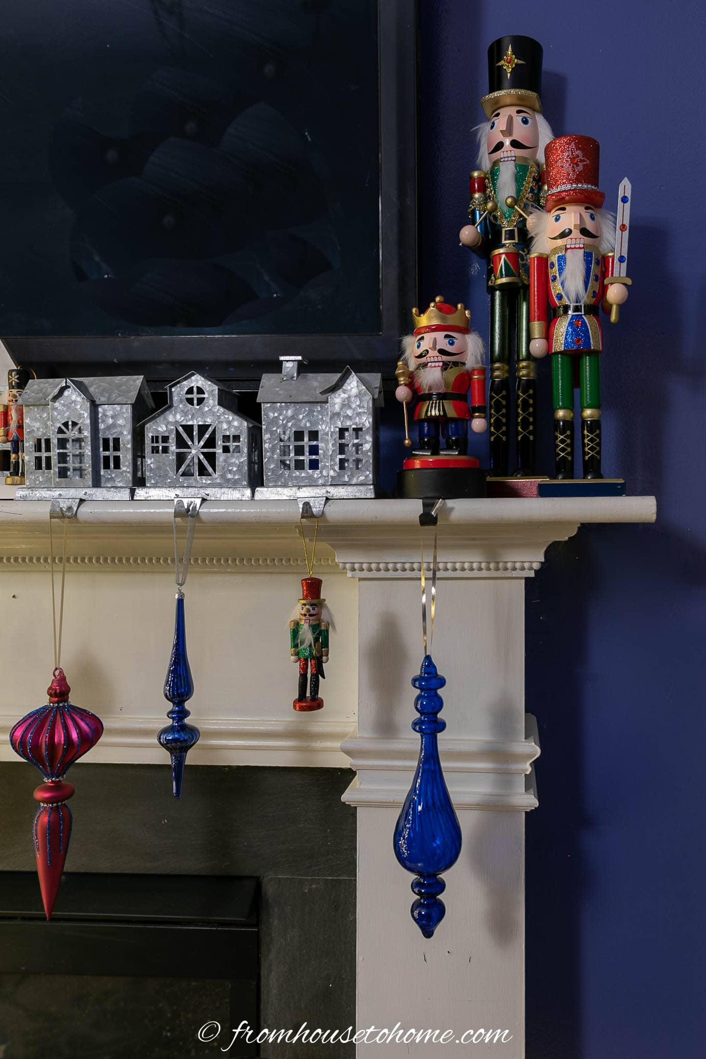 Nutcrackers on the end of a fireplace mantel