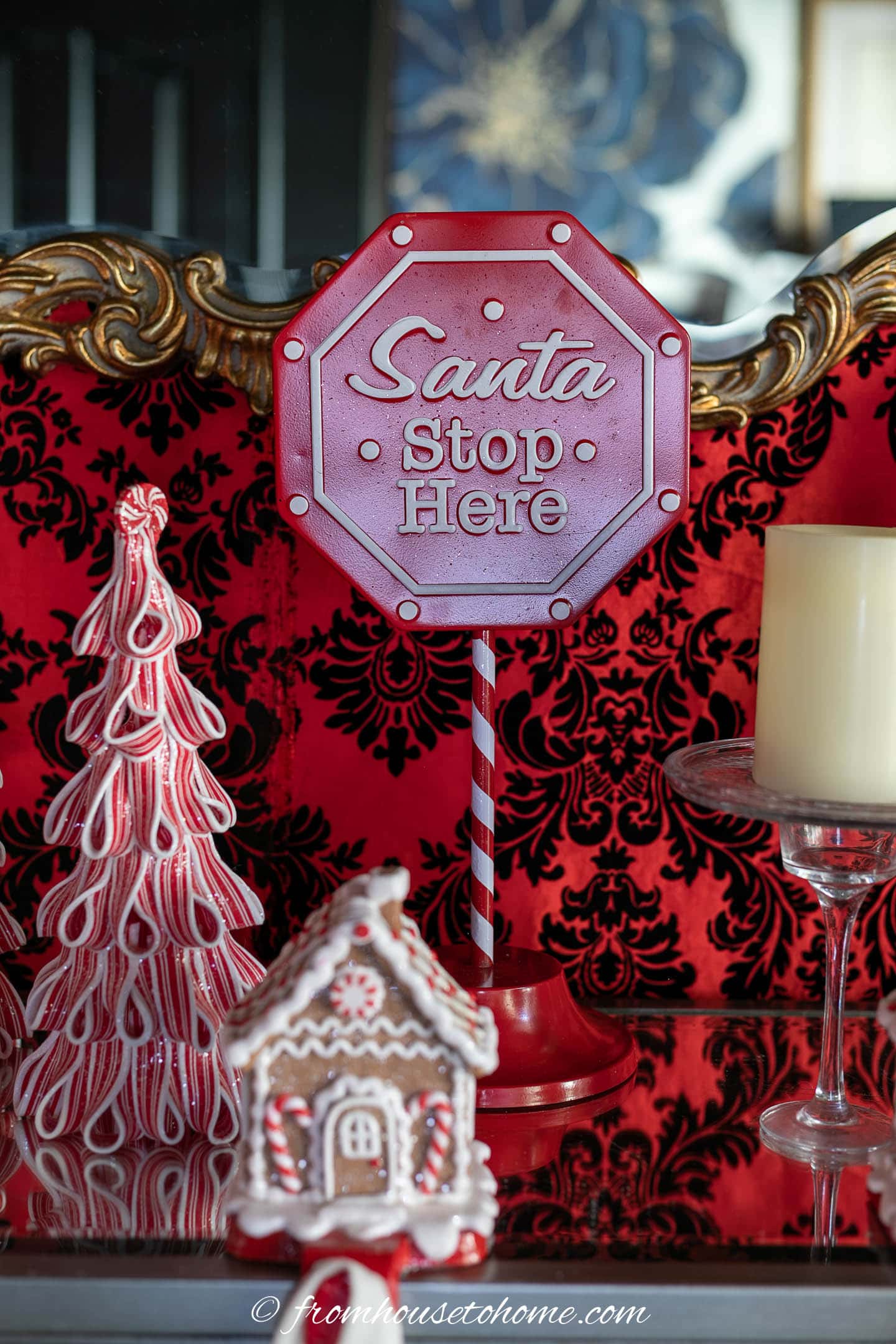 Santa stop sign on a Christmas fireplace mantel