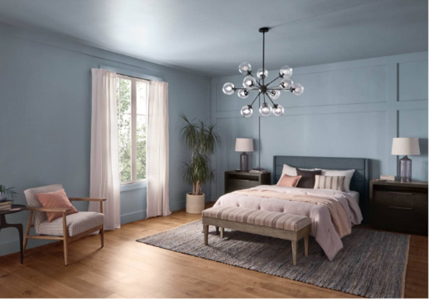 A bedroom painted with the HGTV Home 2022 color of the year 'Aleutian'