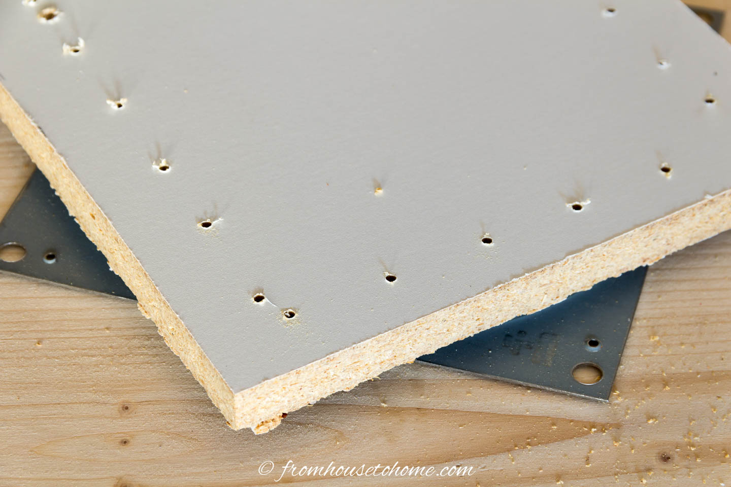 Small melamine board with evenly spaced holes