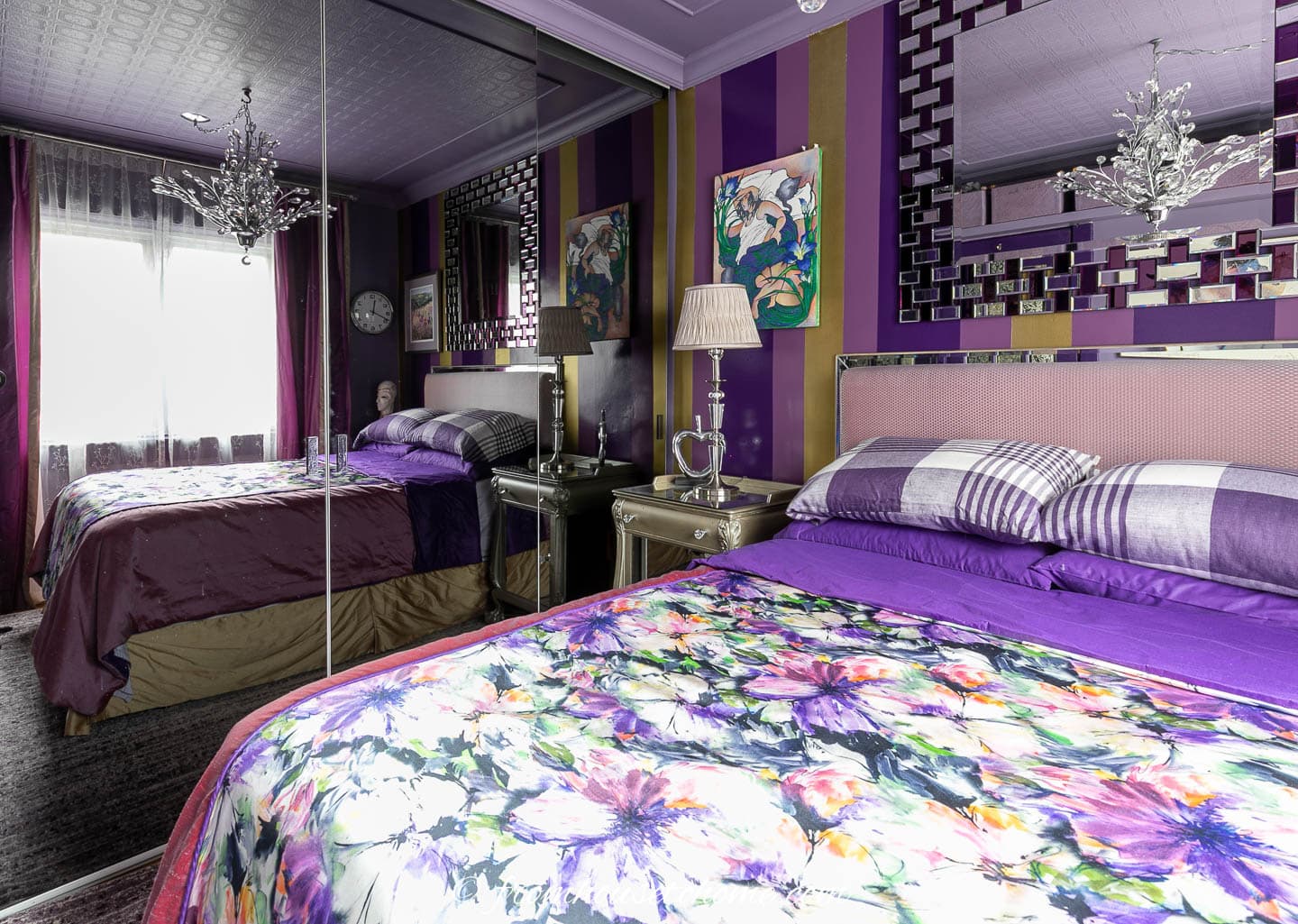 The purple and gold bedroom makeover with painted striped wall