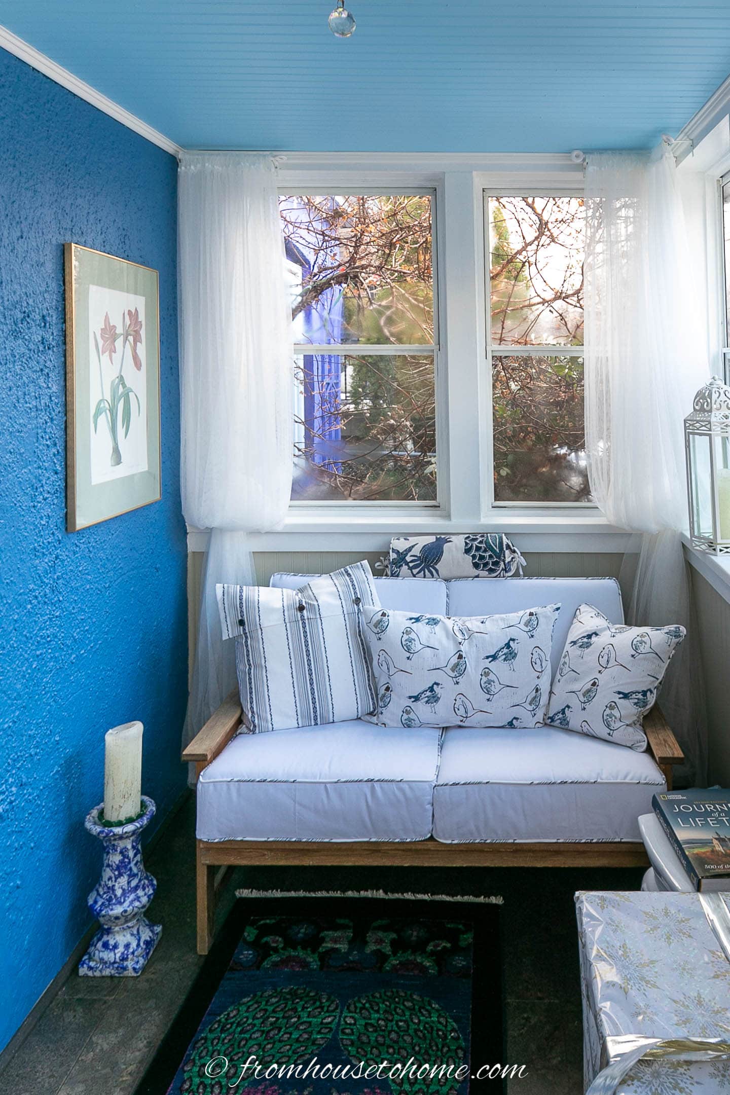 Porch with darker blue walls and a light blue ceiling