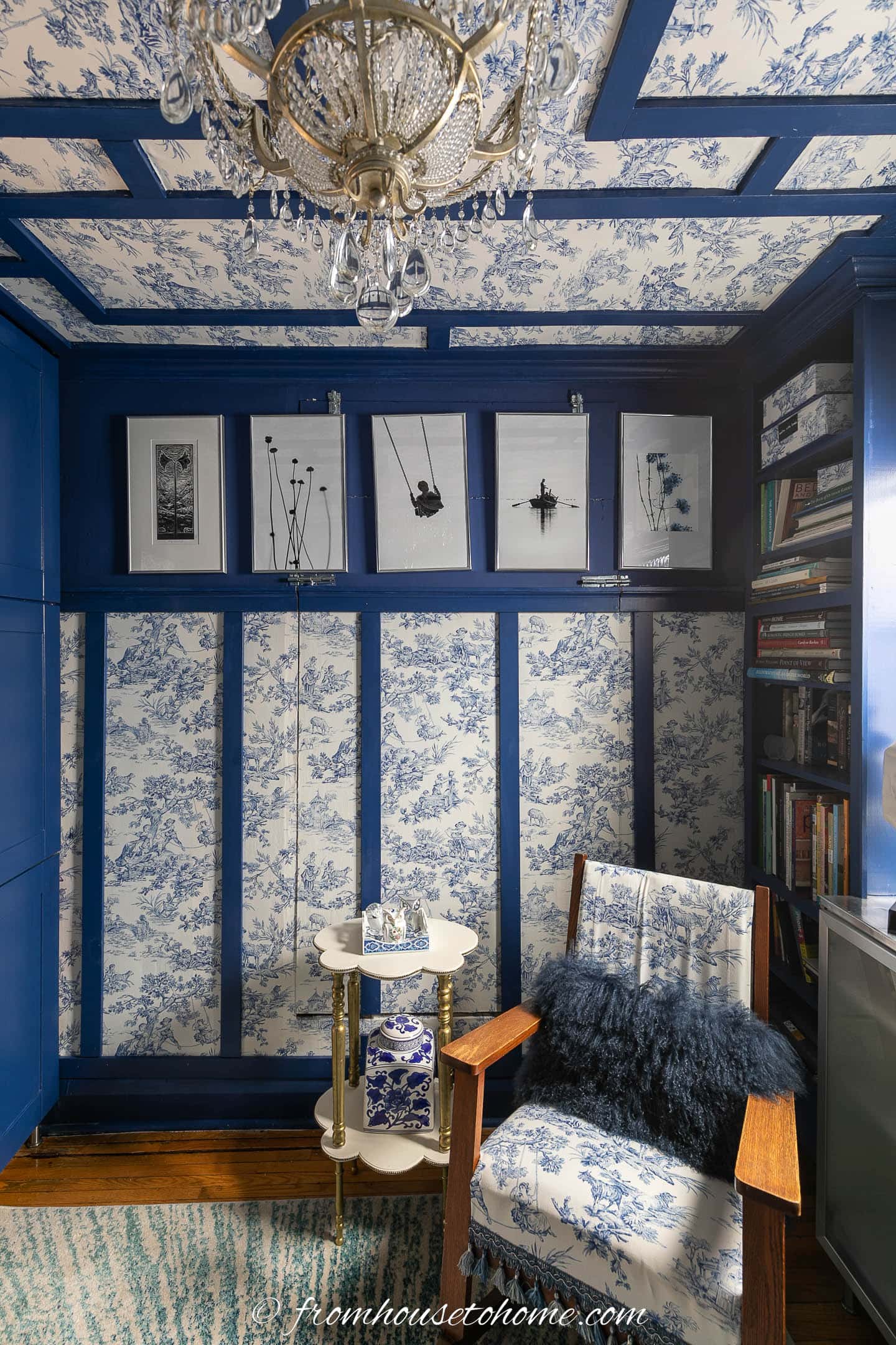 Den with dark blue paint and blue and white panels on the walls and ceiling