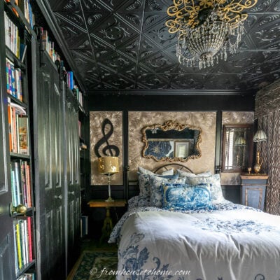 black bedroom with walls and ceiling painted the same color