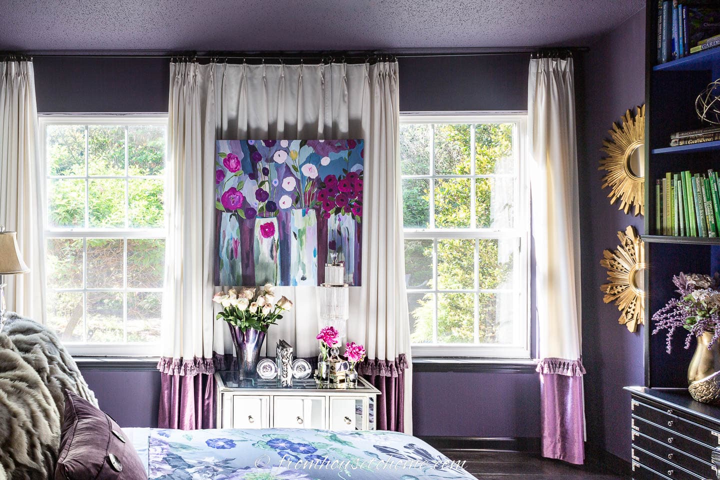 Bedroom walls and ceiling painted dark purple with white and purple curtains
