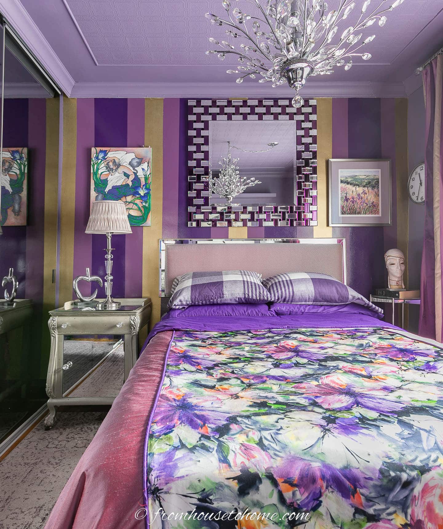 purple and gold bedroom with a lilac ceiling and purple and gold stripes on the wall behind the bed