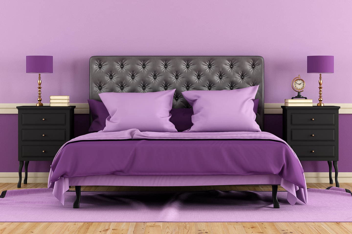 purple bed in a bedroom with the top half of the walls painted light purple and bottom half painted dark purple