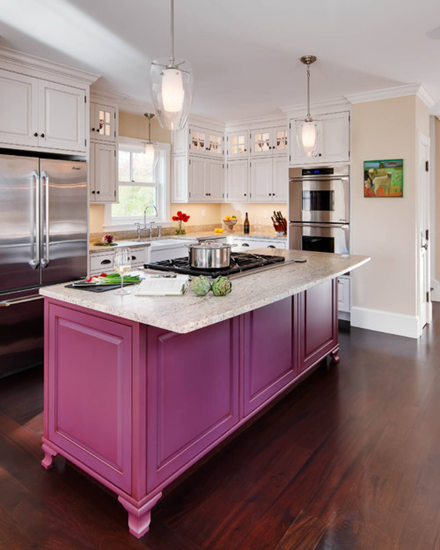 Traditional kitchen white white cabinets and countertops, and medium pink base cabinets in the island