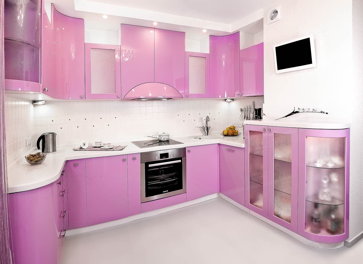 Retro-style kitchen with high gloss pink cabinets, which countertops and backsplash with rounded corners