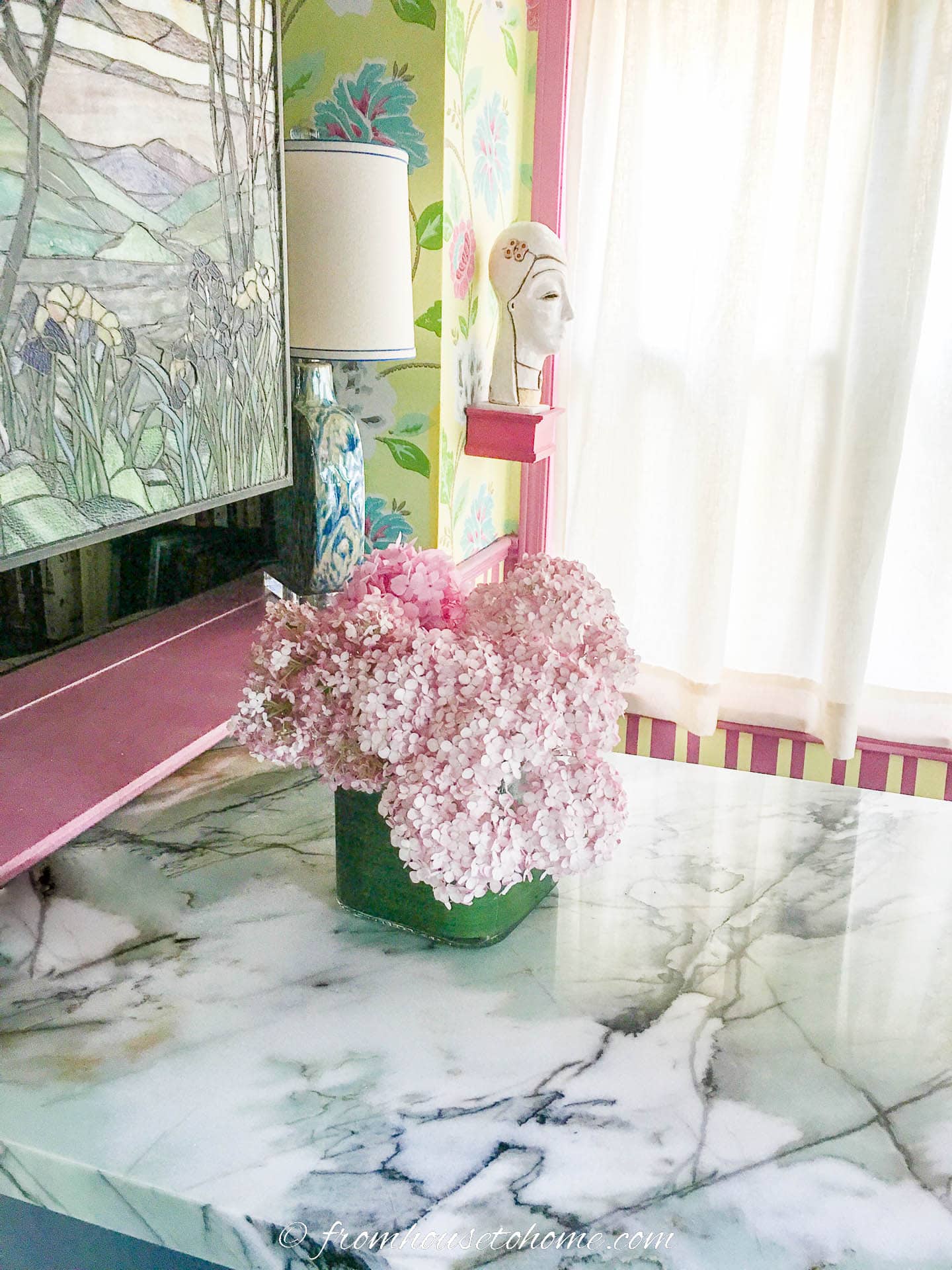 Pink hydrangeas on a teal, white and black quartzite countertop