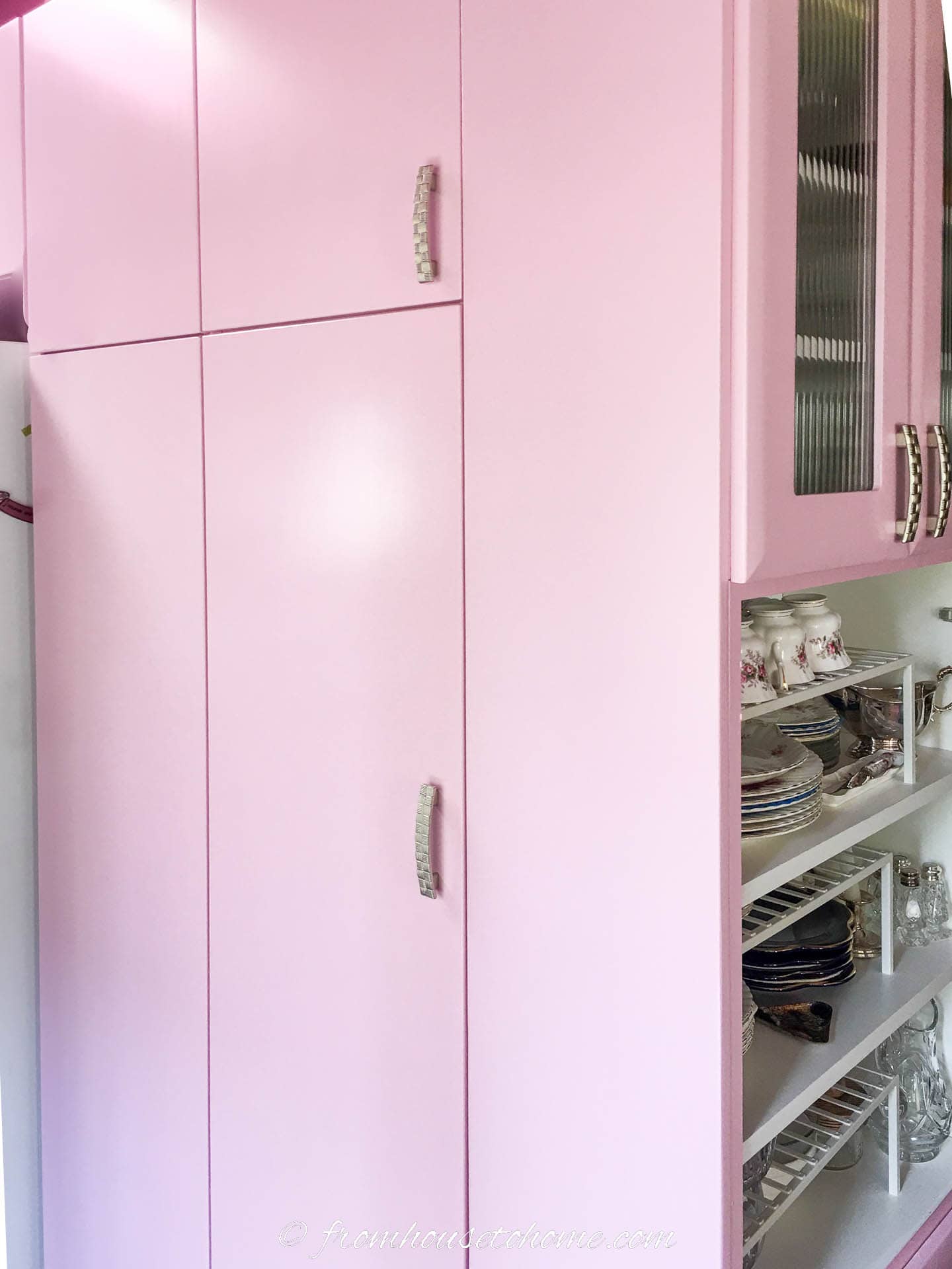 IKEA pantry cabinets painted light pink with pewter cabinet handles