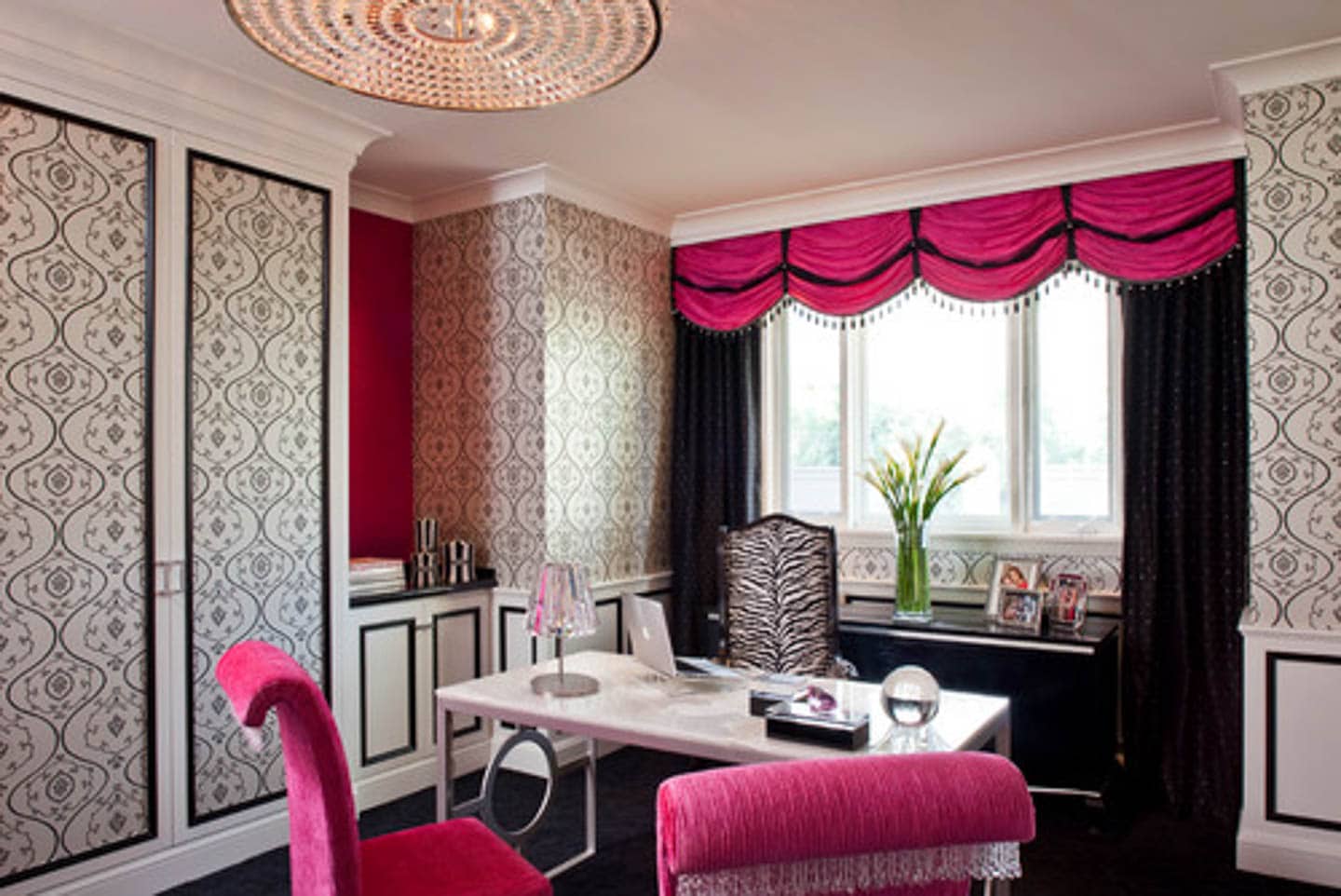Black and white office with fuchsia curtains and side chairs