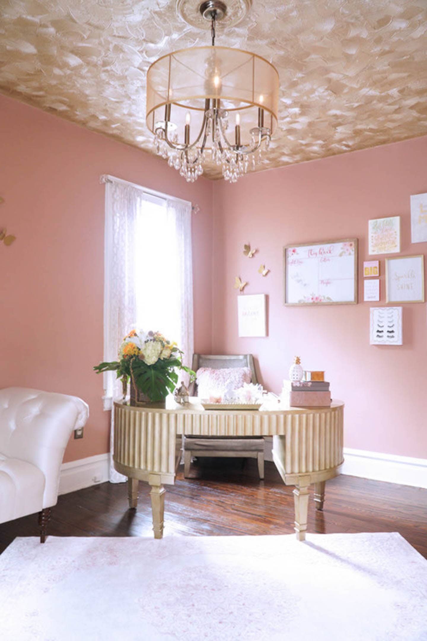 Hollywood glam home office with pink walls, ceiling and chandelier
