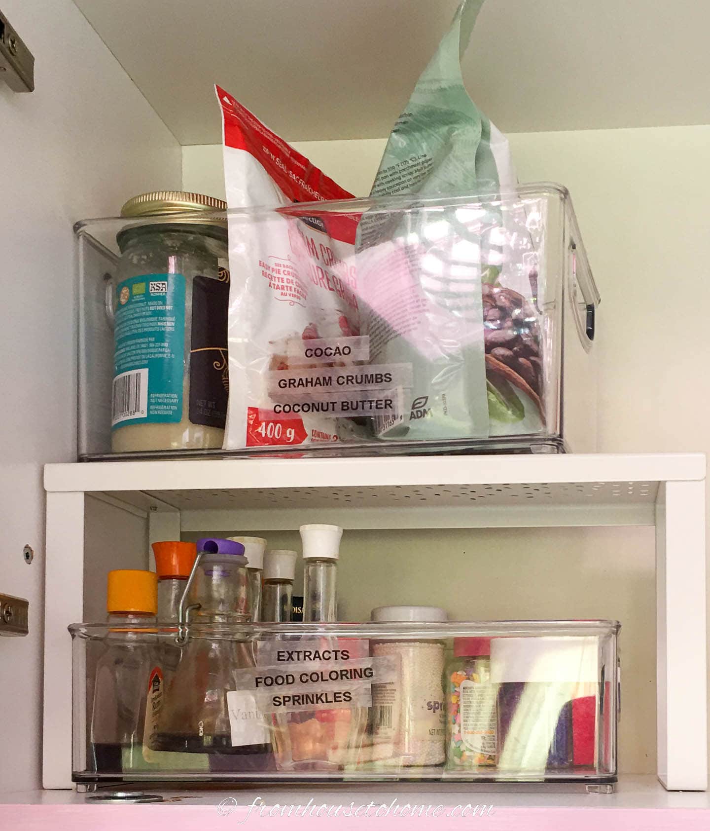 Kitchen cabinet storing baking supplies in plastic containers on racks