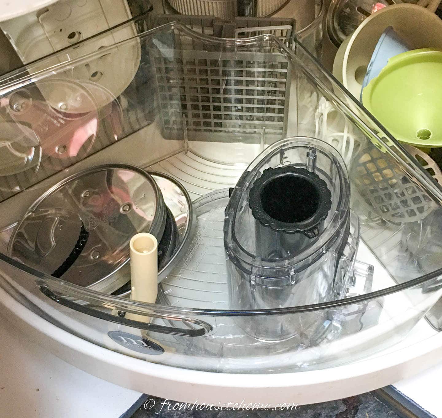 Clear pie-shaped kitchen organizers in a lazy Susan with kitchen accessories inside