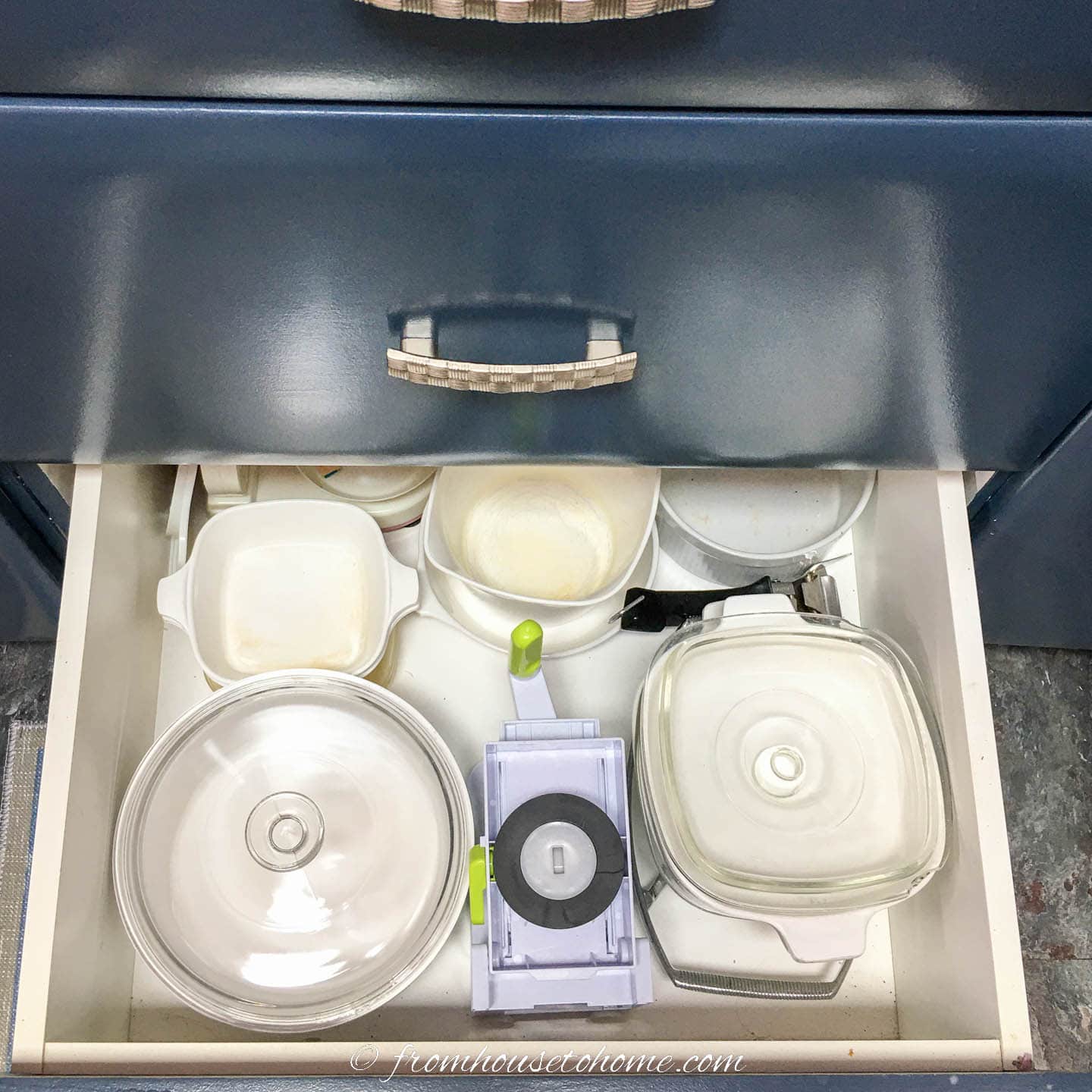 Glass baking dishes in a kitchen drawer