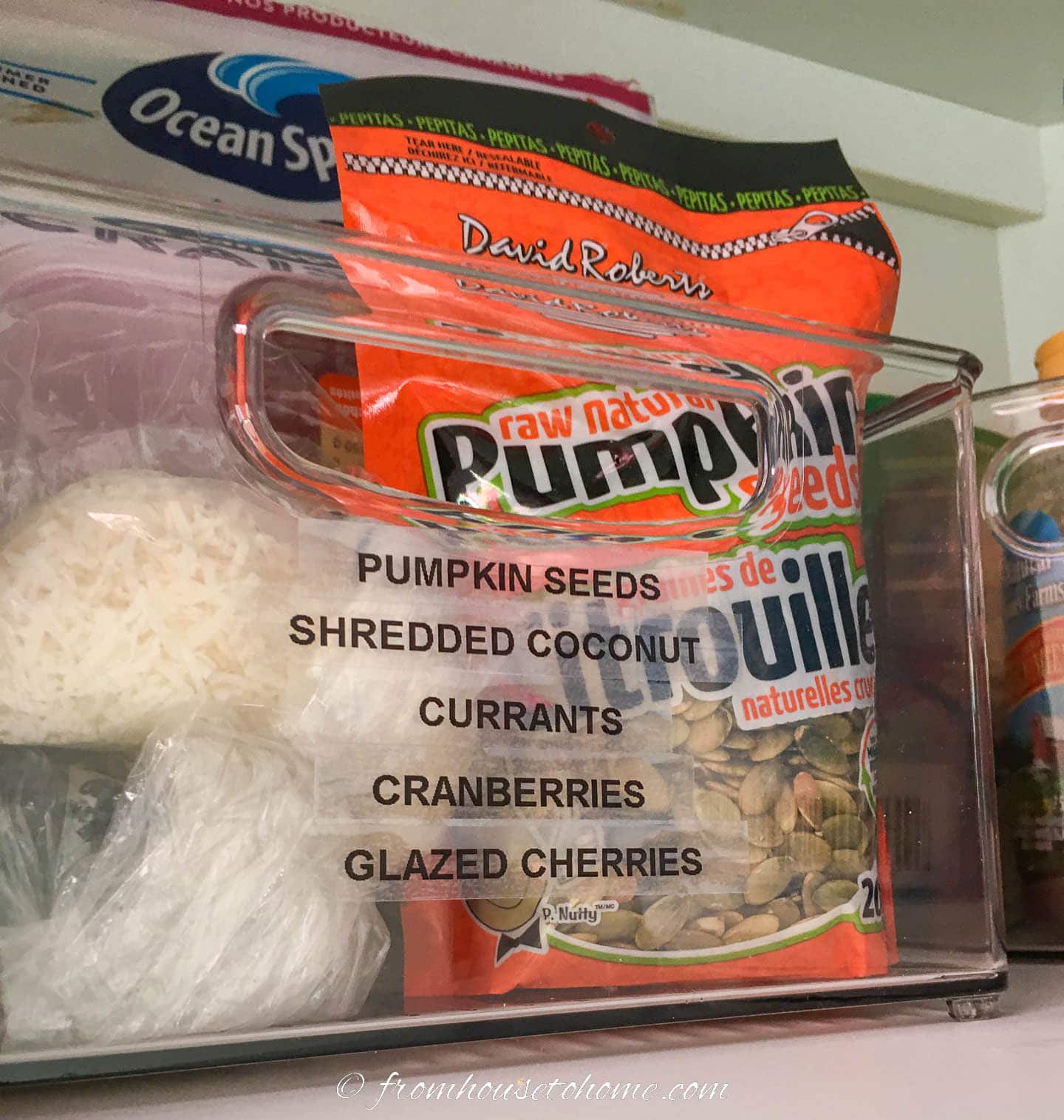 Baking supplies stored in a plastic container with labels on the front