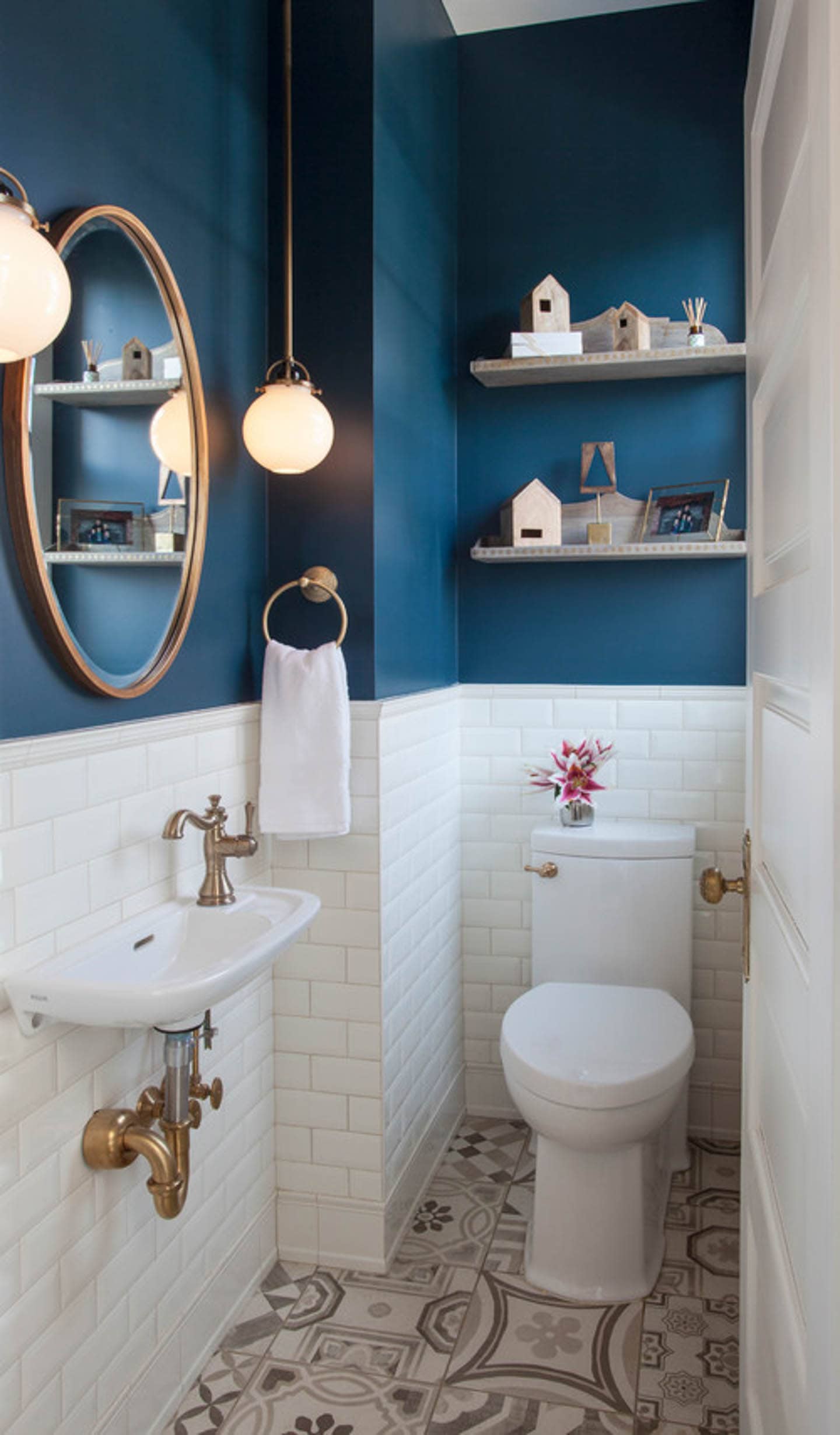 Small bathroom with white subway tile wainscot and Hague Blue painted above