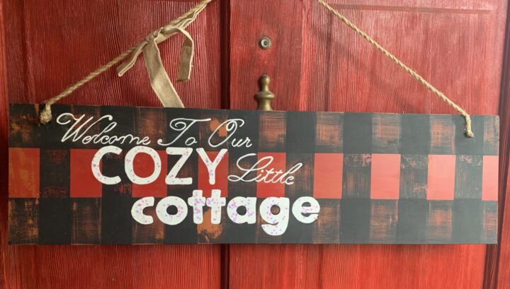 red and black buffalo check cozy cottage sign