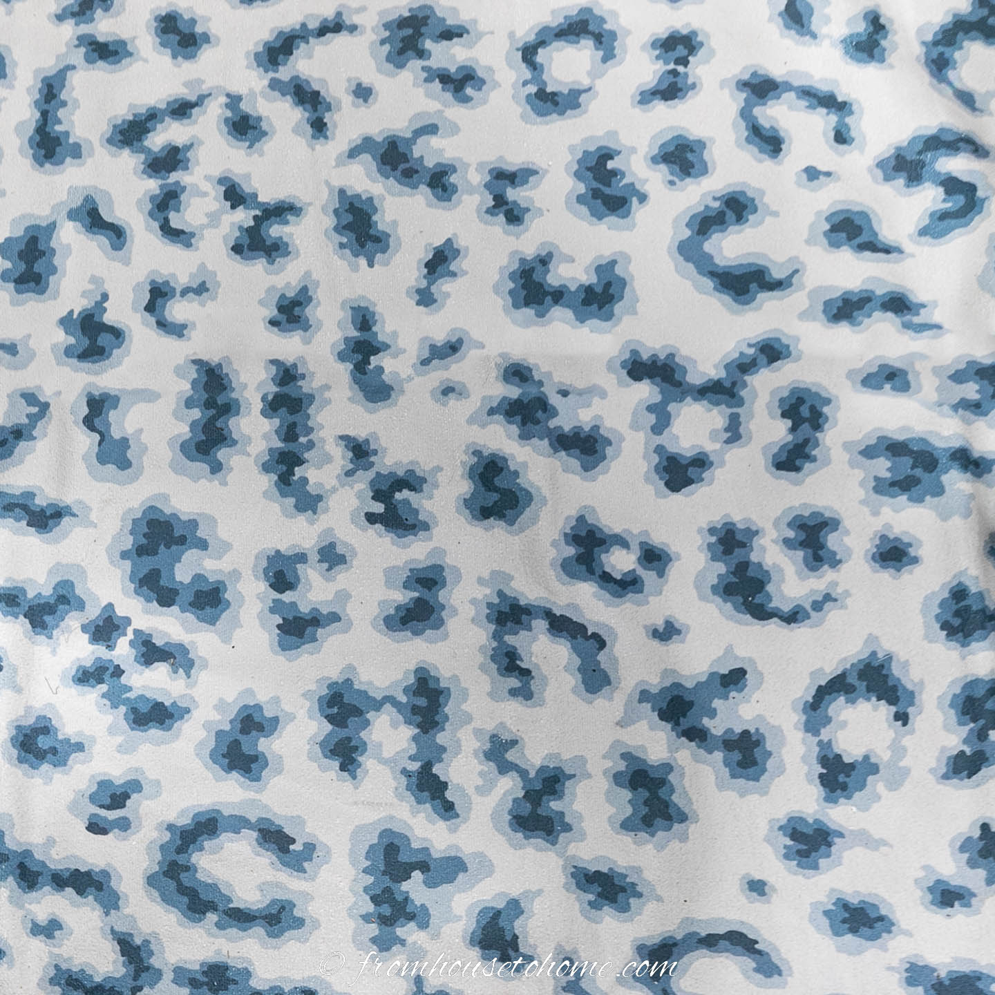 Blue and white cheetah print area rug
