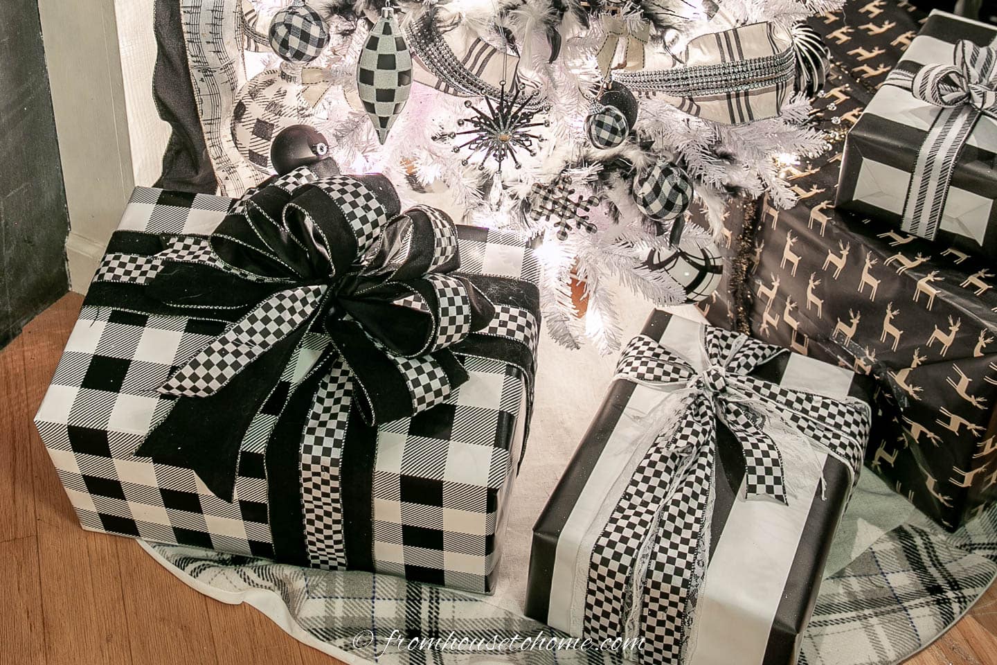 Presents wrapped with black and white paper and tied with black and white ribbons