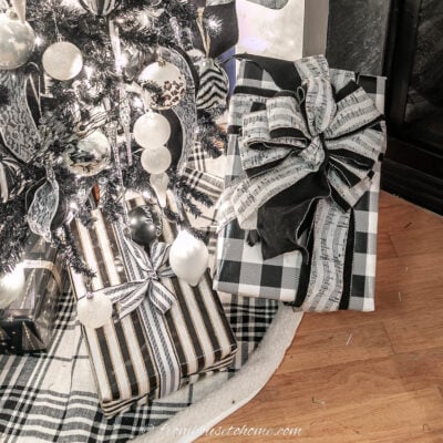presents wrapped in black and white paper and ribbons