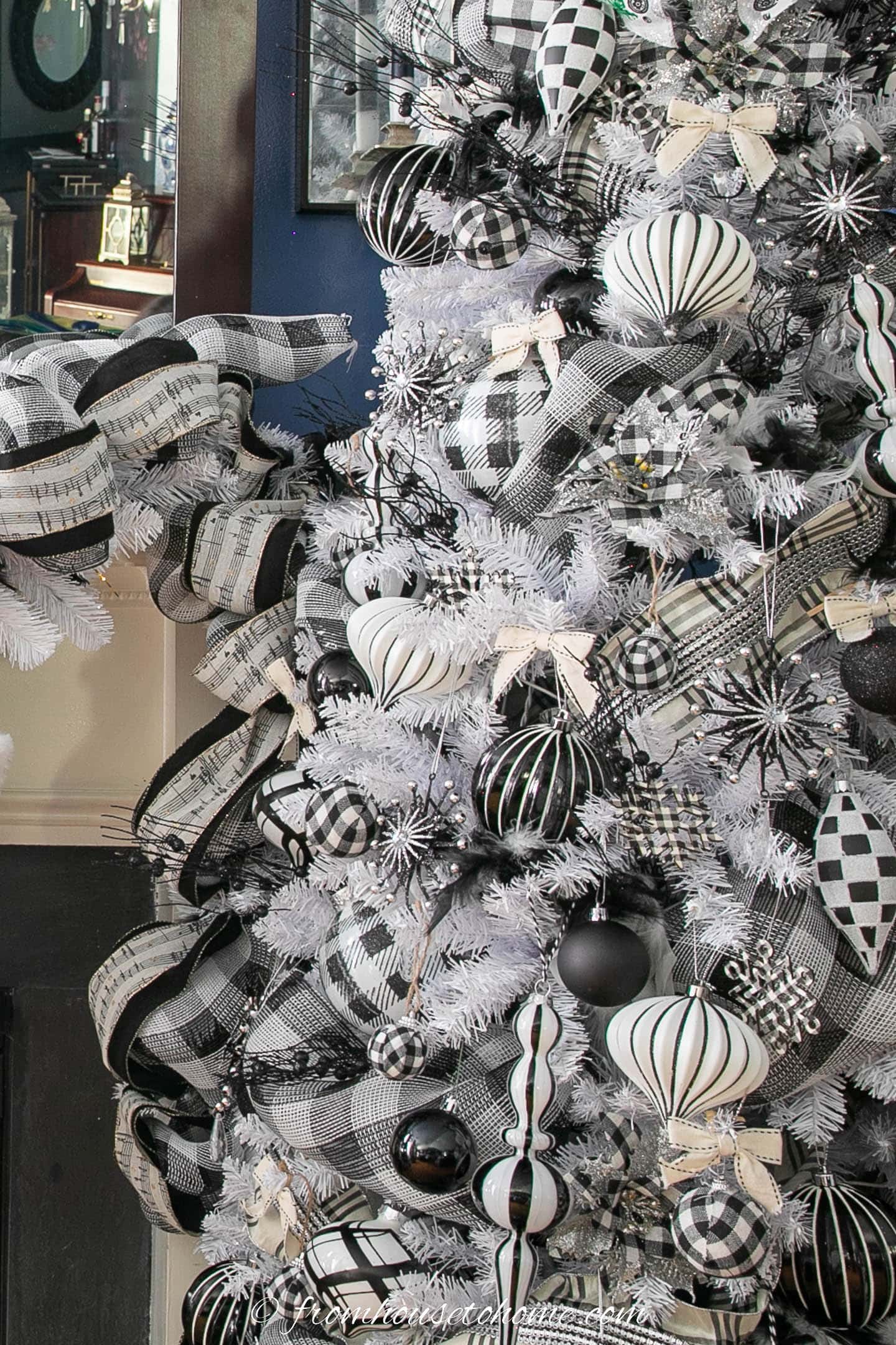 Black and white ornaments on a white Christmas tree