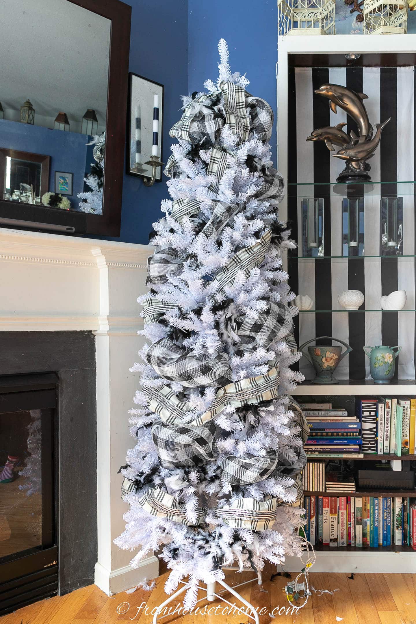 White Christmas tree with black and white feather boas, buffalo check deco mesh and plaid ribbon