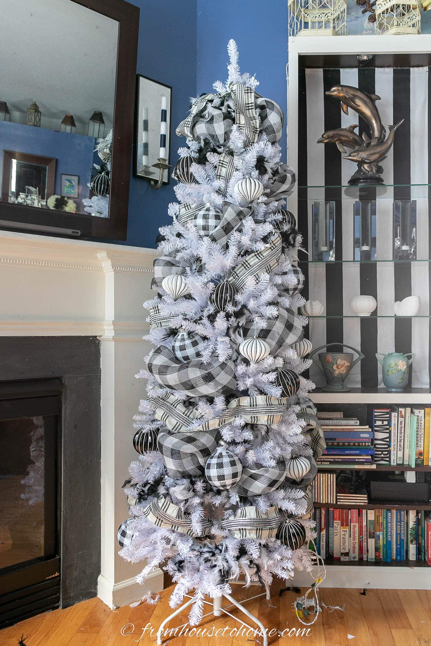 White Christmas tree with black and white boas, buffalo check deco mesh, plaid ribbon and large black and white ornaments