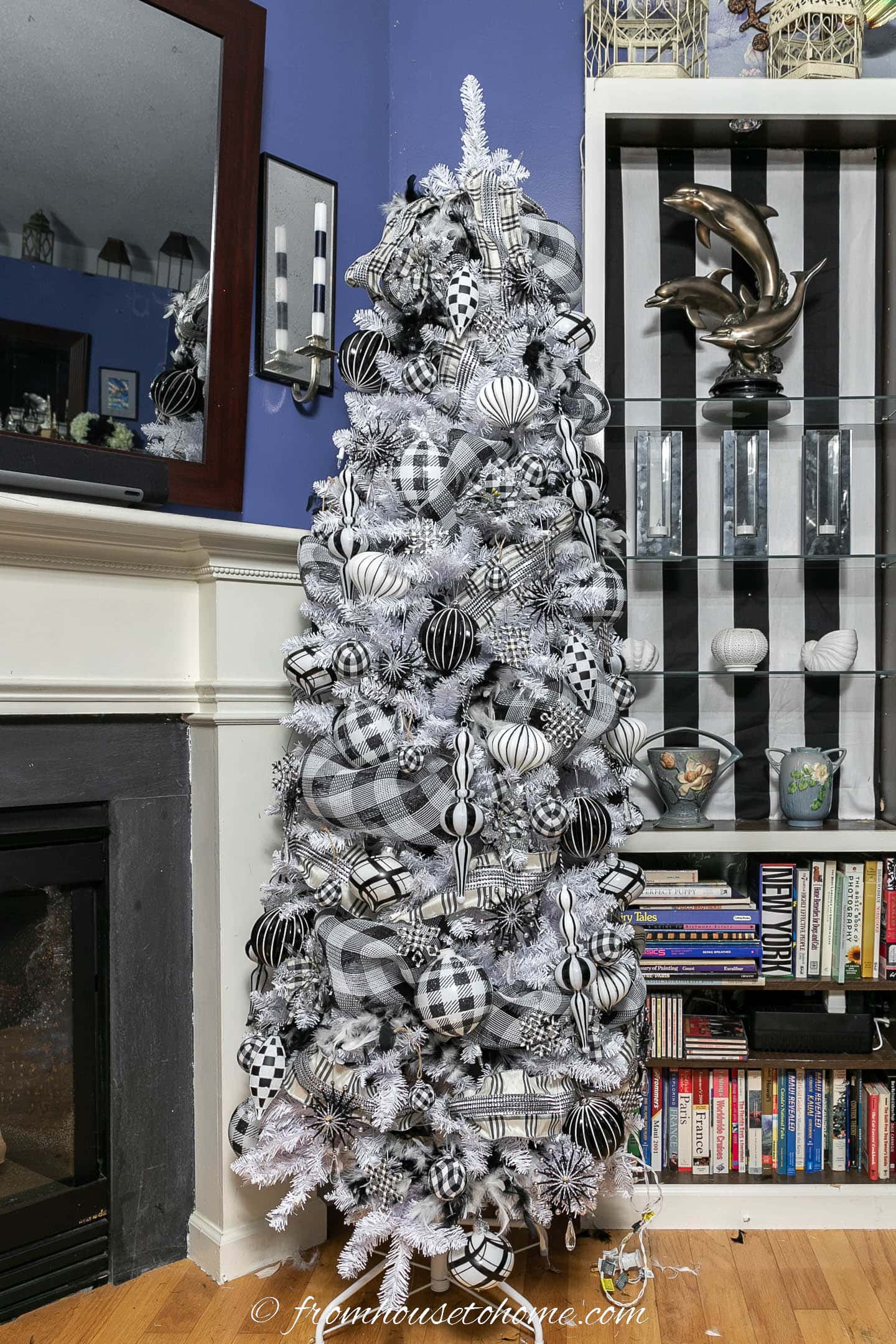 White Christmas tree with black and white feather boas, buffalo check deco mesh, plaid ribbon and plaid ornaments