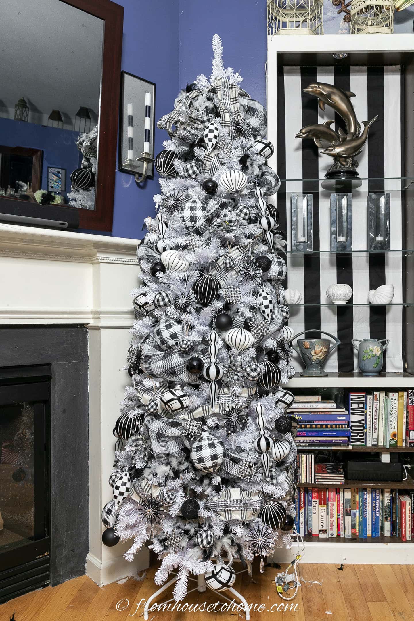 White Christmas tree with black and white feather boas, buffalo check deco mesh, plaid ribbon, plaid ornaments and black ornaments