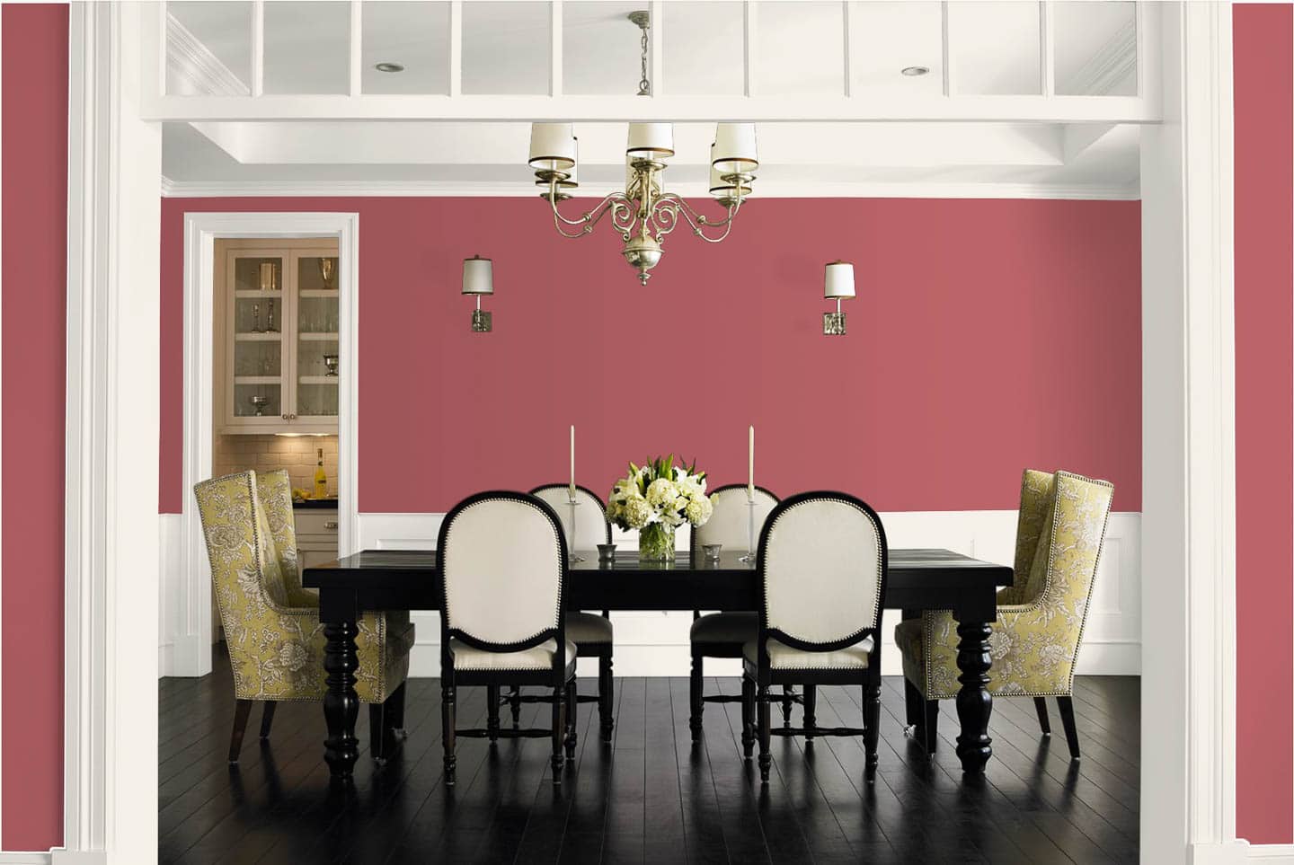 Dining room painted in Dunn Edwards 2023 color of the year 'Terra Rosa' with black and white furnishings