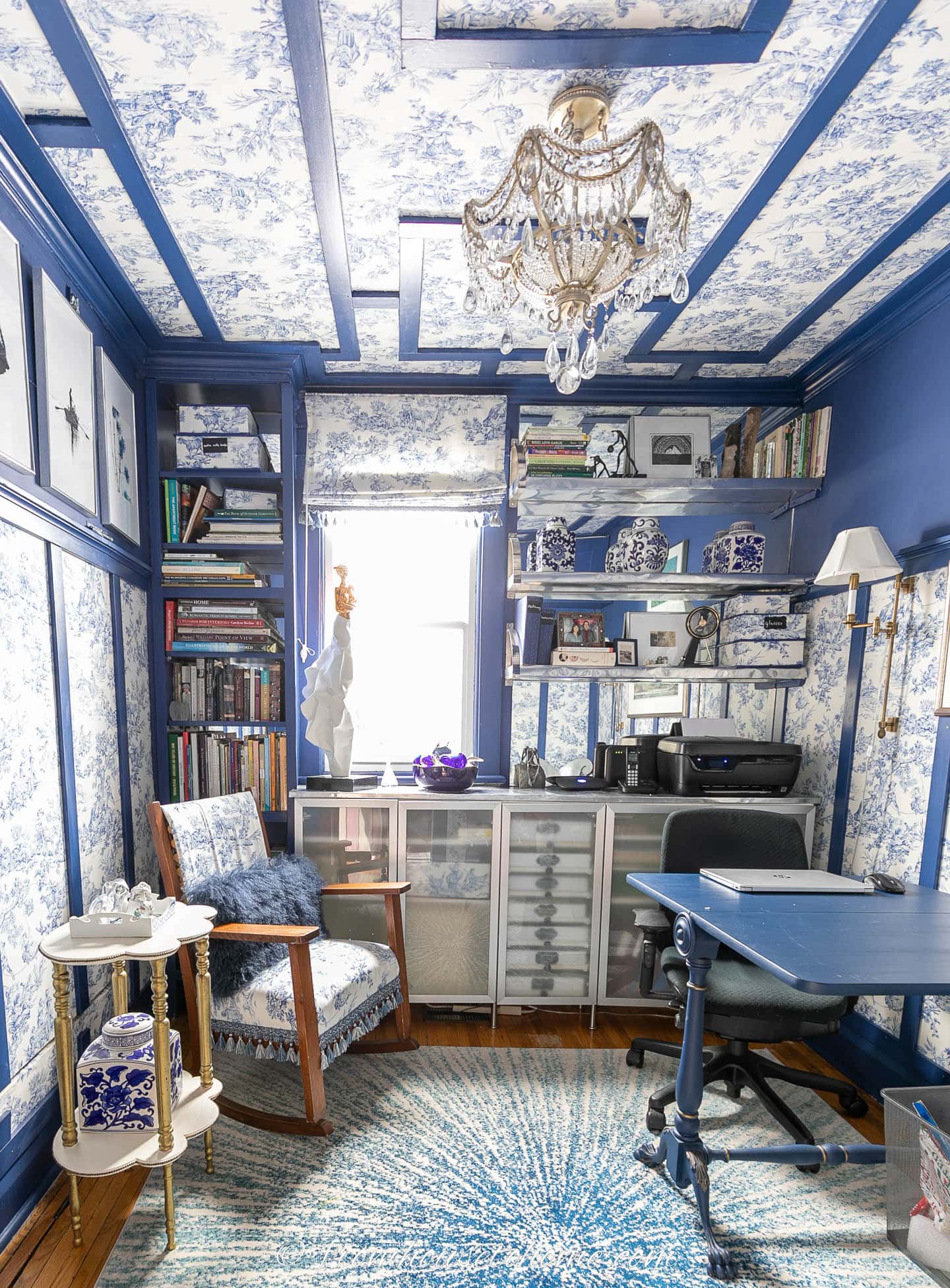 The home office "after" - with a chandelier and blue and white toile on the ceiling and walls