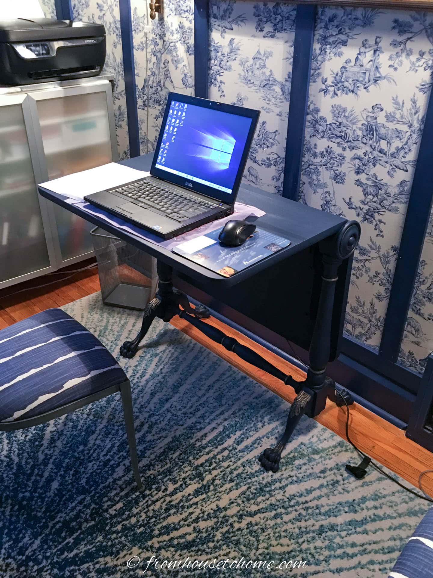 Half-opened drop leaf table being used as a desk 