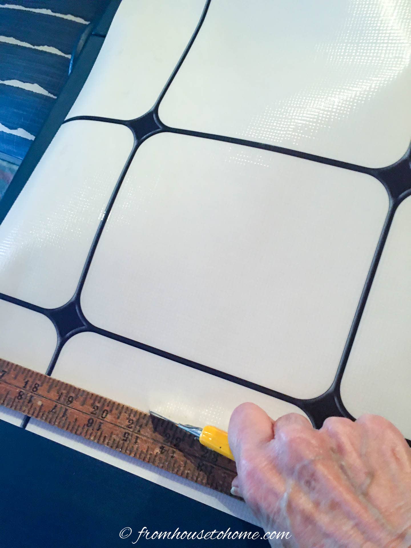 Window film being cut with a utility knife