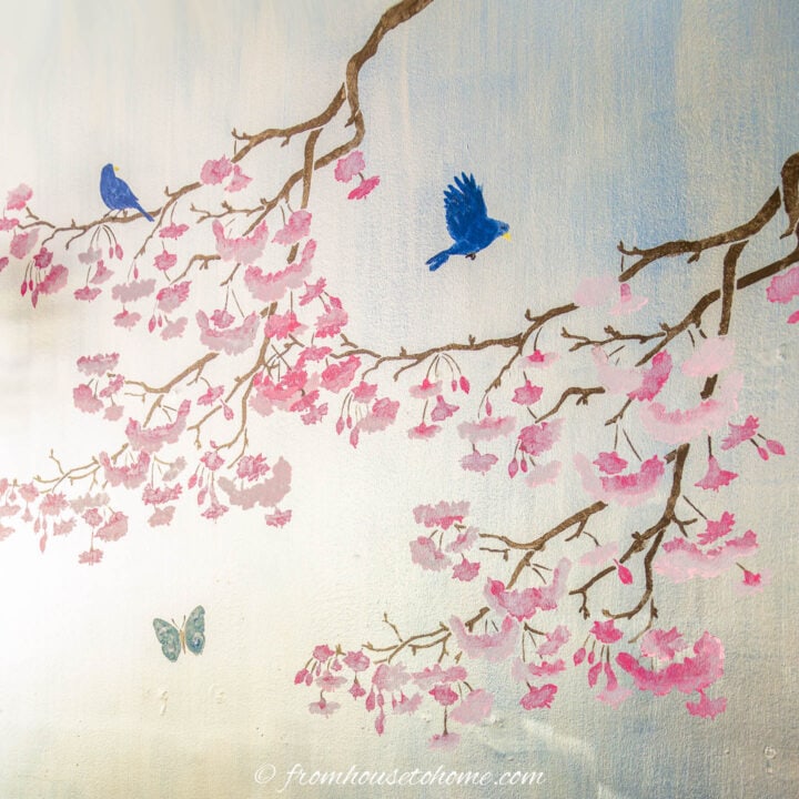 silver wall with stenciled cherry blossoms