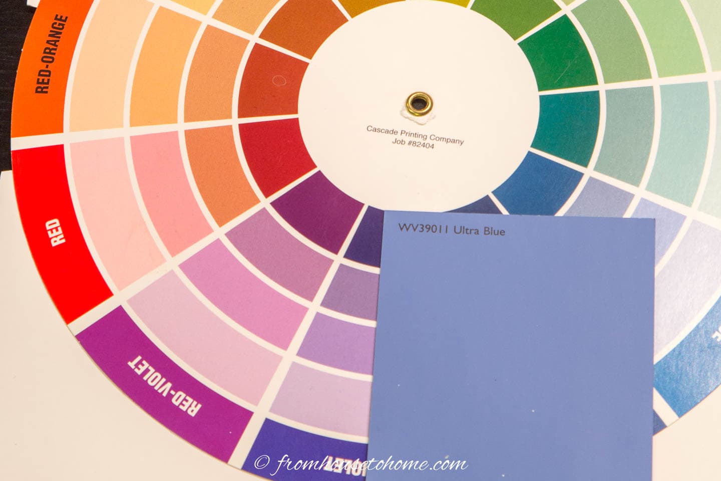 A color wheel with a blue paint swatch next to it
