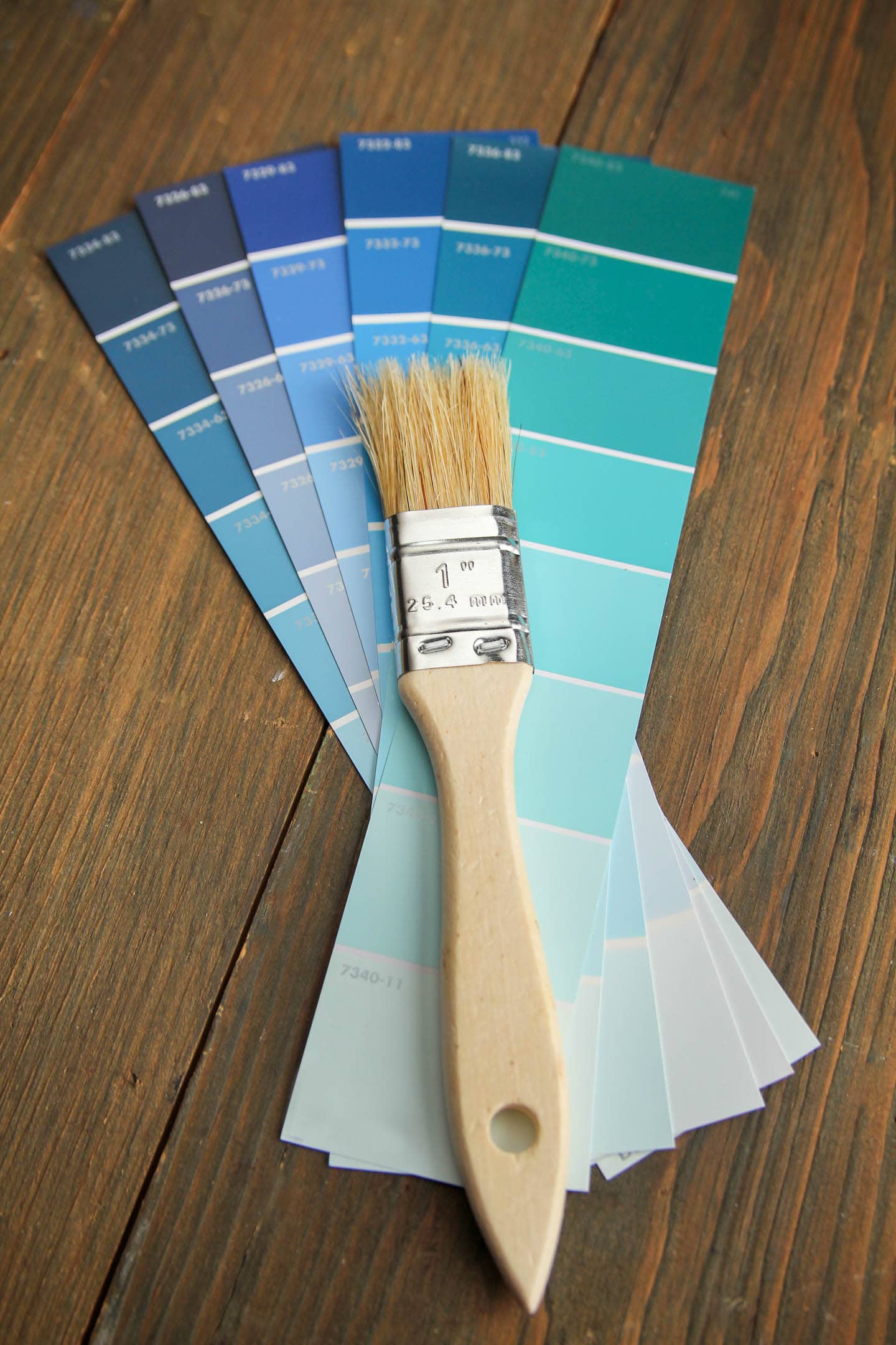 Blue paint swatches with a paint brush on top