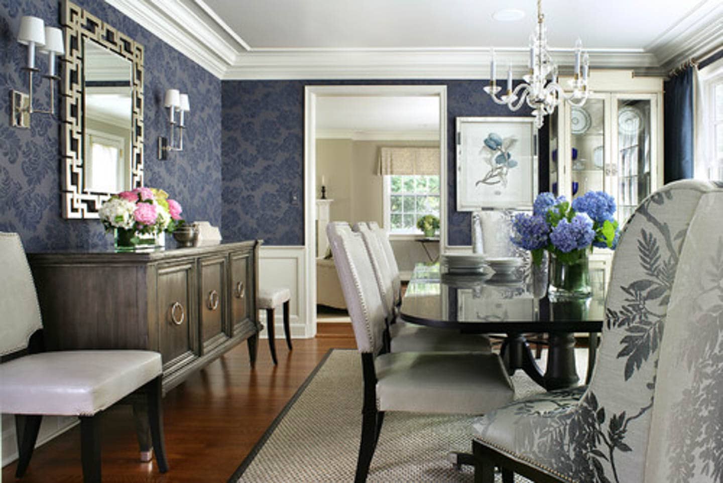 Dining room with blue walls an gray furniture
