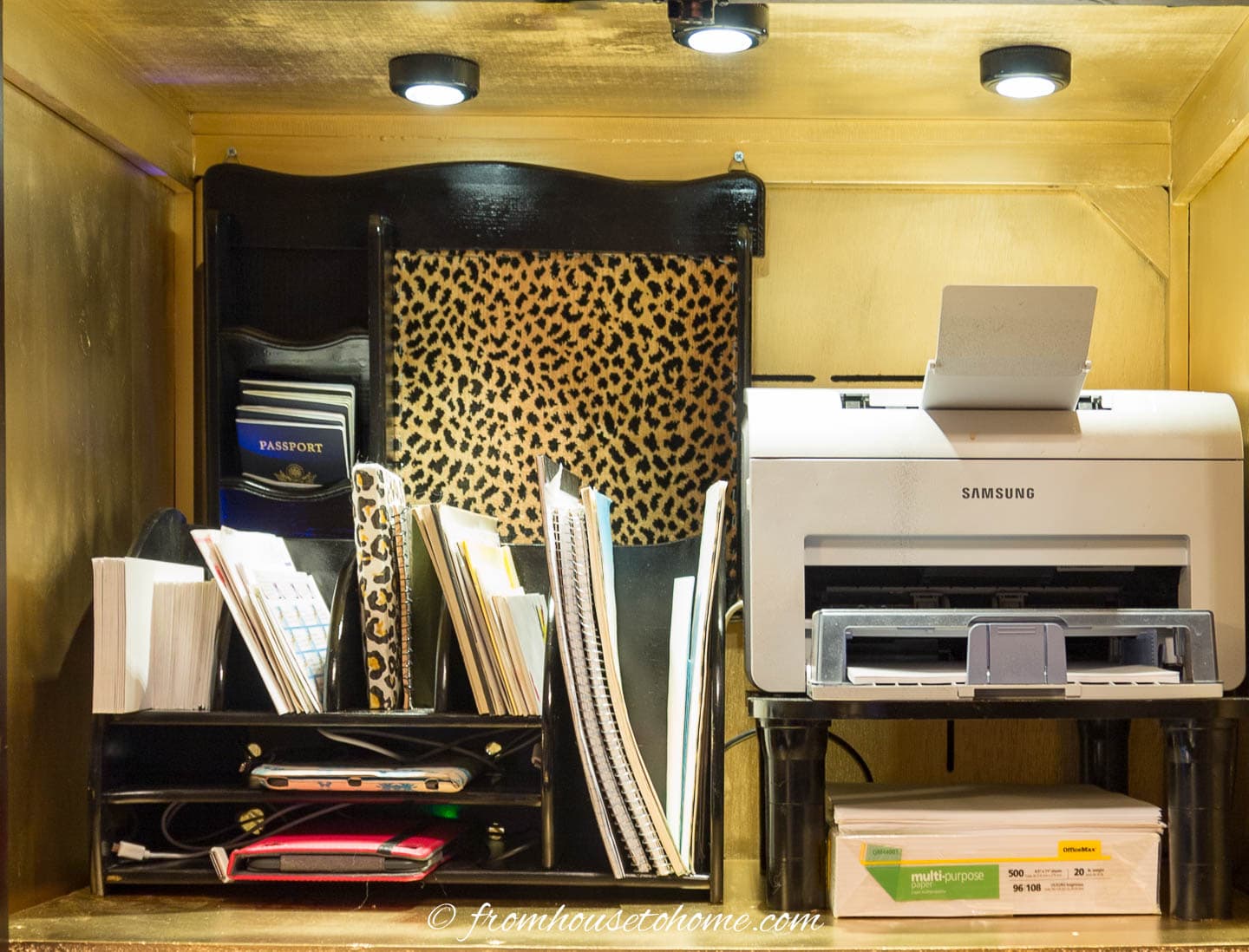 Printer, paper, electronics and notebook storage with puck lights overhead