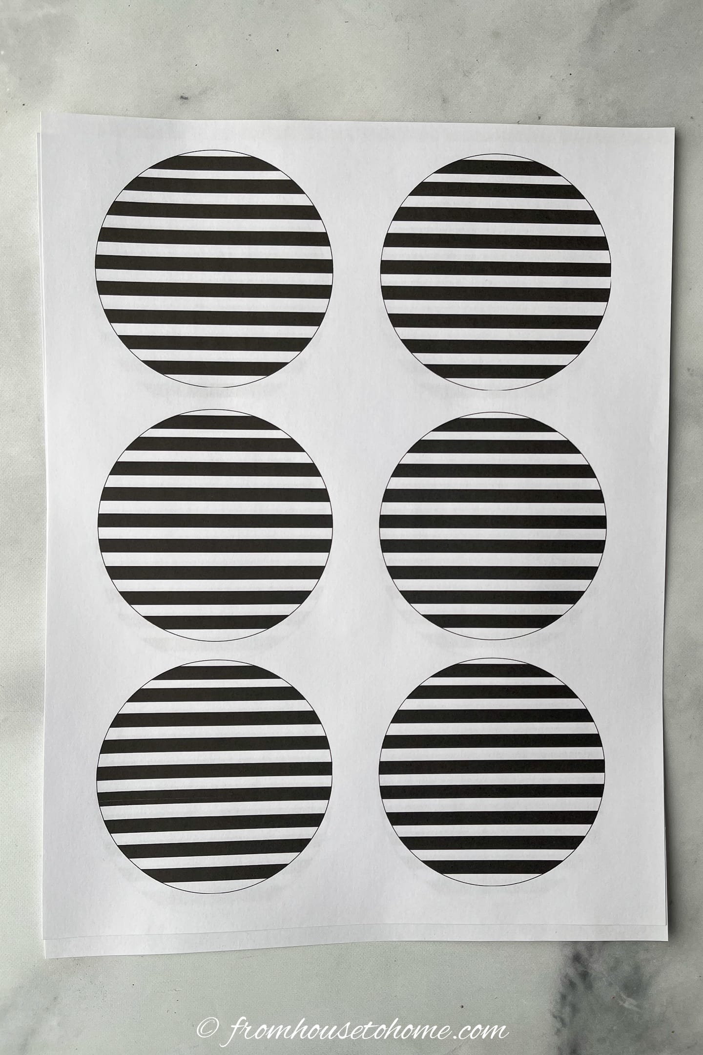 Black and white striped circles printed on a piece of paper